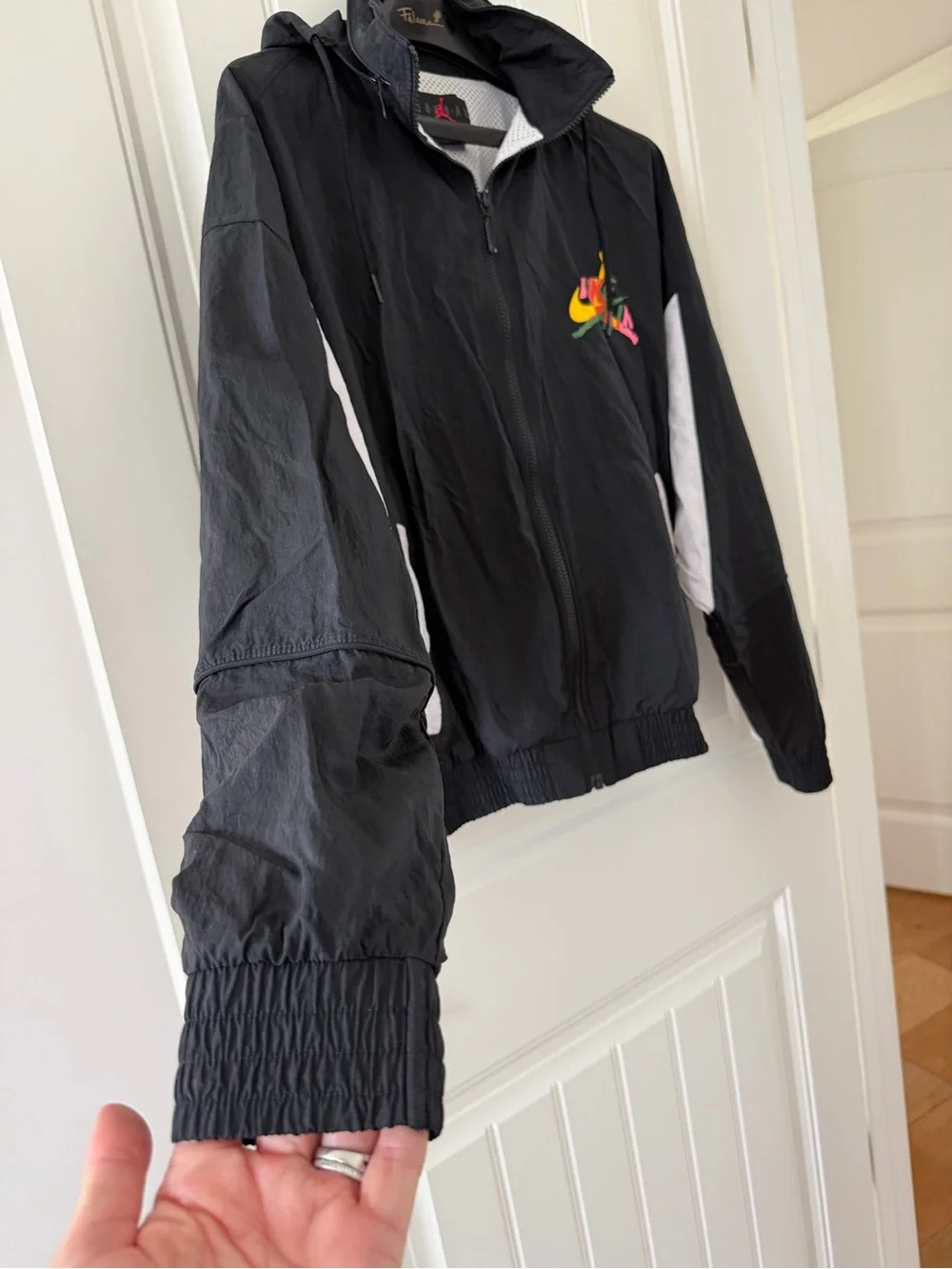 Jordan Black Hooded Windbreaker with Multicolor Logo Accent